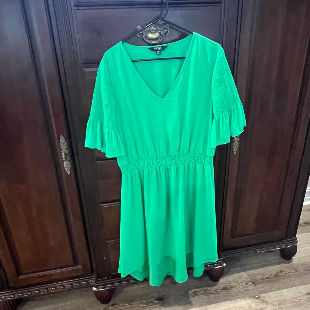 Issac Mirahi.  Green dress